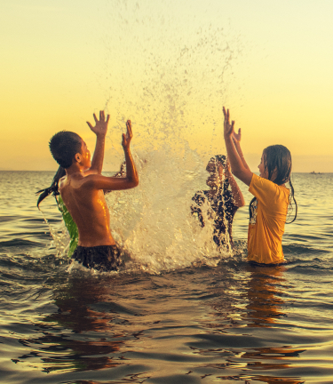 Children in the ocean in Costa Rica