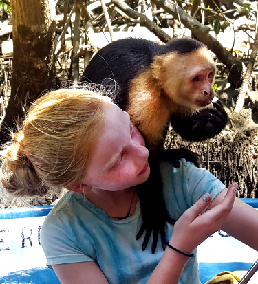 Girl in a monkey habitat in Costa Rica